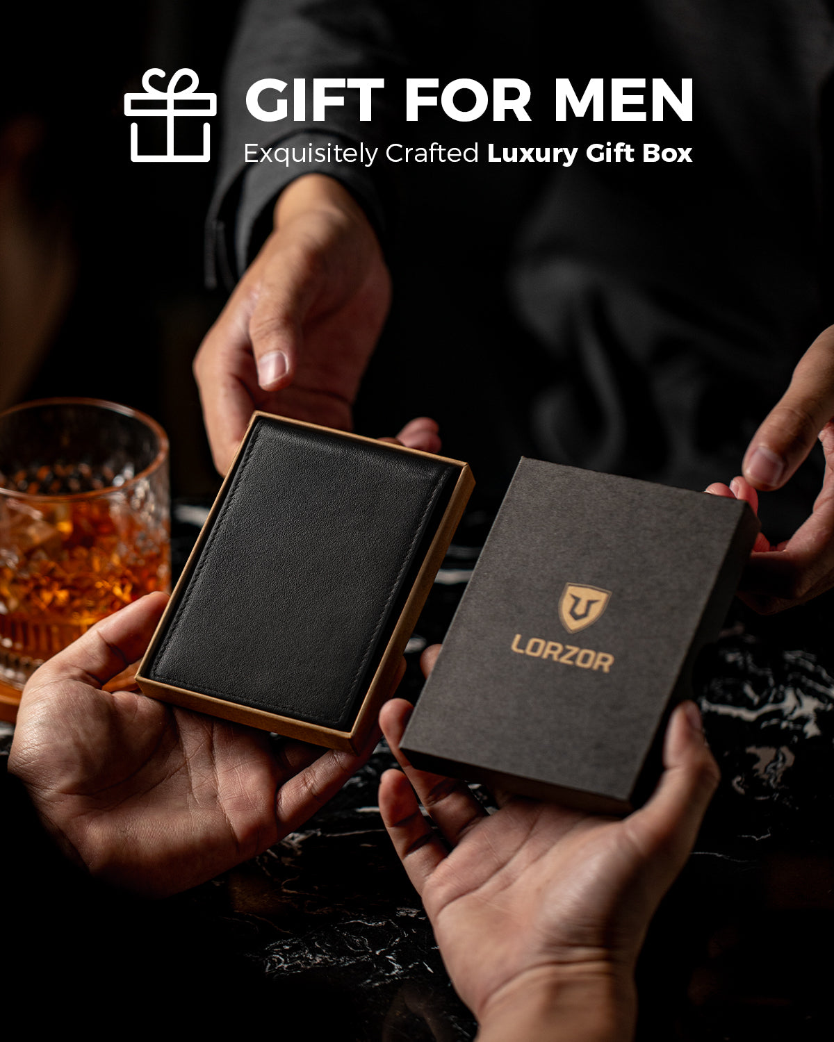 Black leather wallet presented in an open gift box with branded lid