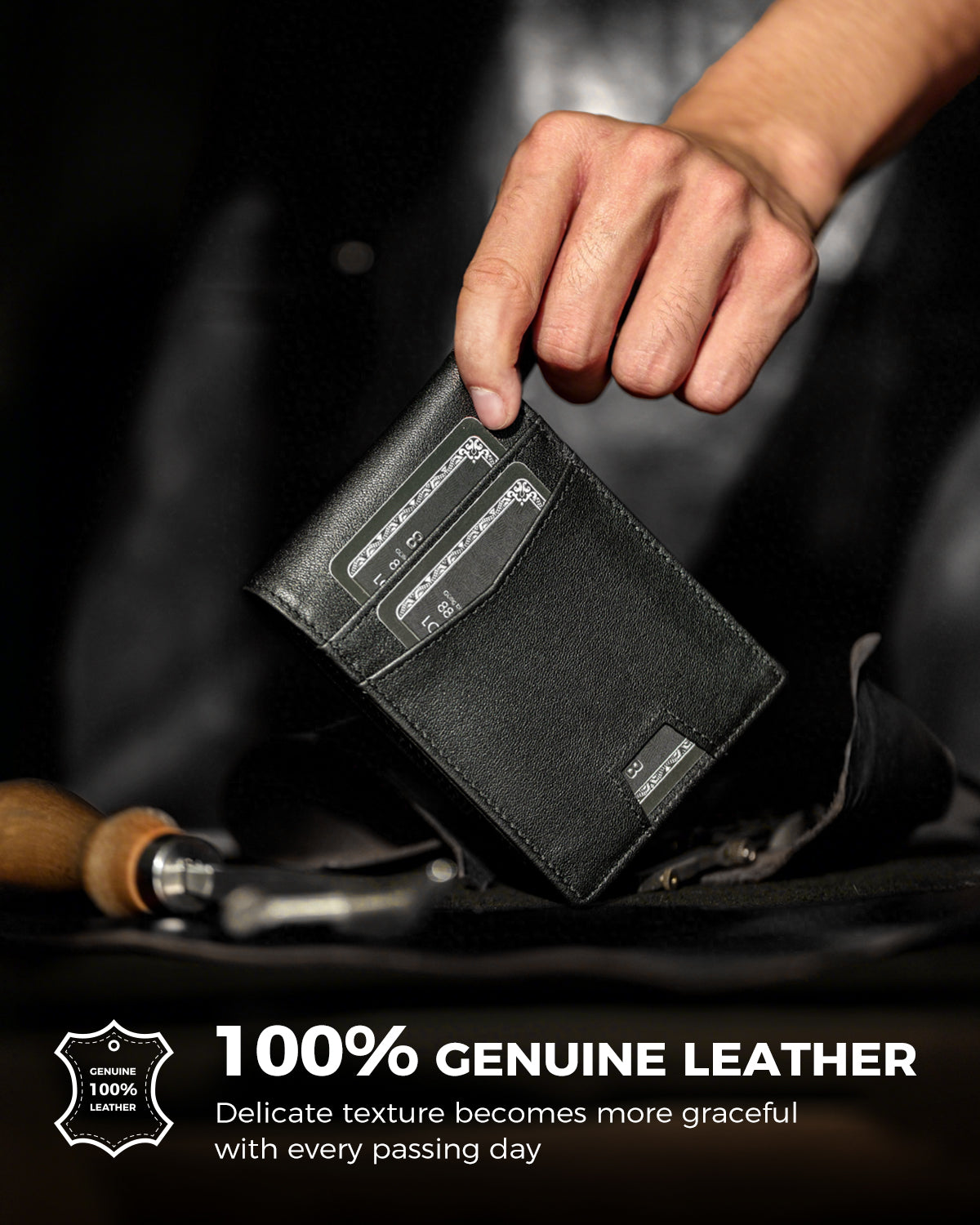 Hand holding a black leather wallet with cards in the front pockets