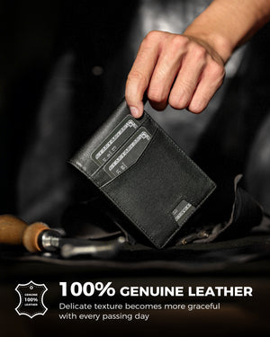 Hand holding a black leather wallet with cards in the front pockets